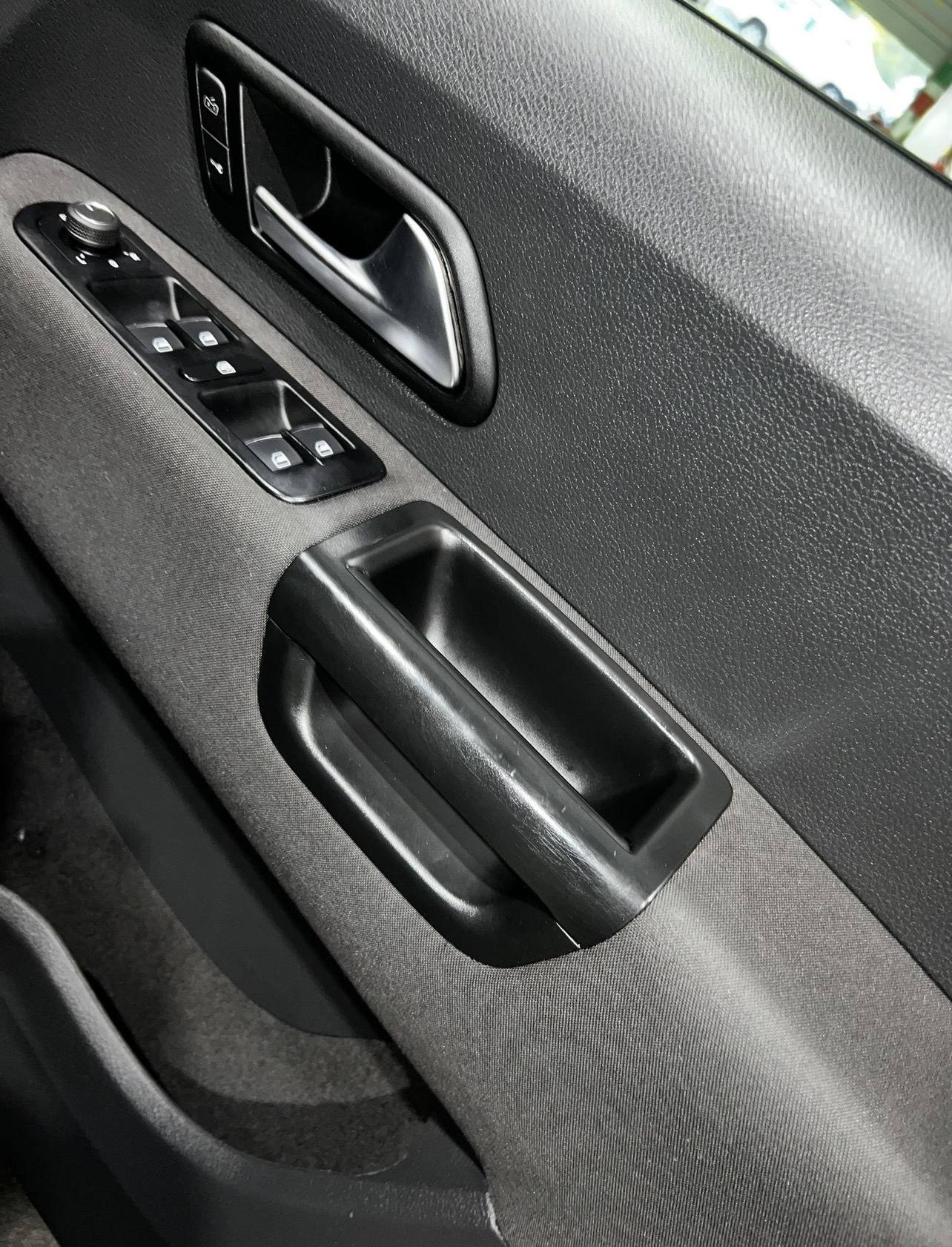Detailed vehicle door panel and controls