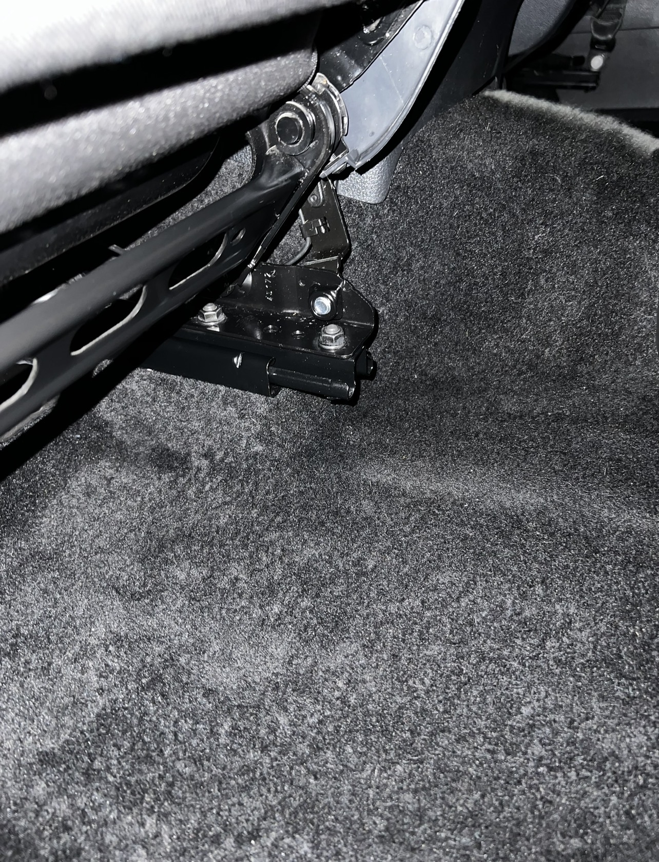 Detailed carpet and seat mounting area